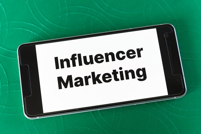 Words “influencer marketing” displayed on a smartphone.